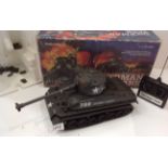 A Radio Shack radio controlled Sherman Tank catalogue number 60-3098 complete with controller and