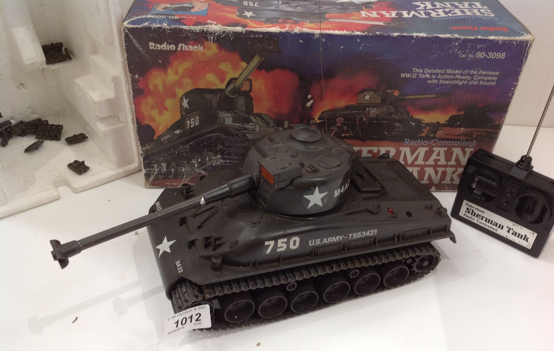 A Radio Shack radio controlled Sherman Tank catalogue number 60-3098 complete with controller and