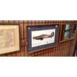 A framed mirrored print of a Spitfire with many facsimile autographs of famous RAF air men and a
