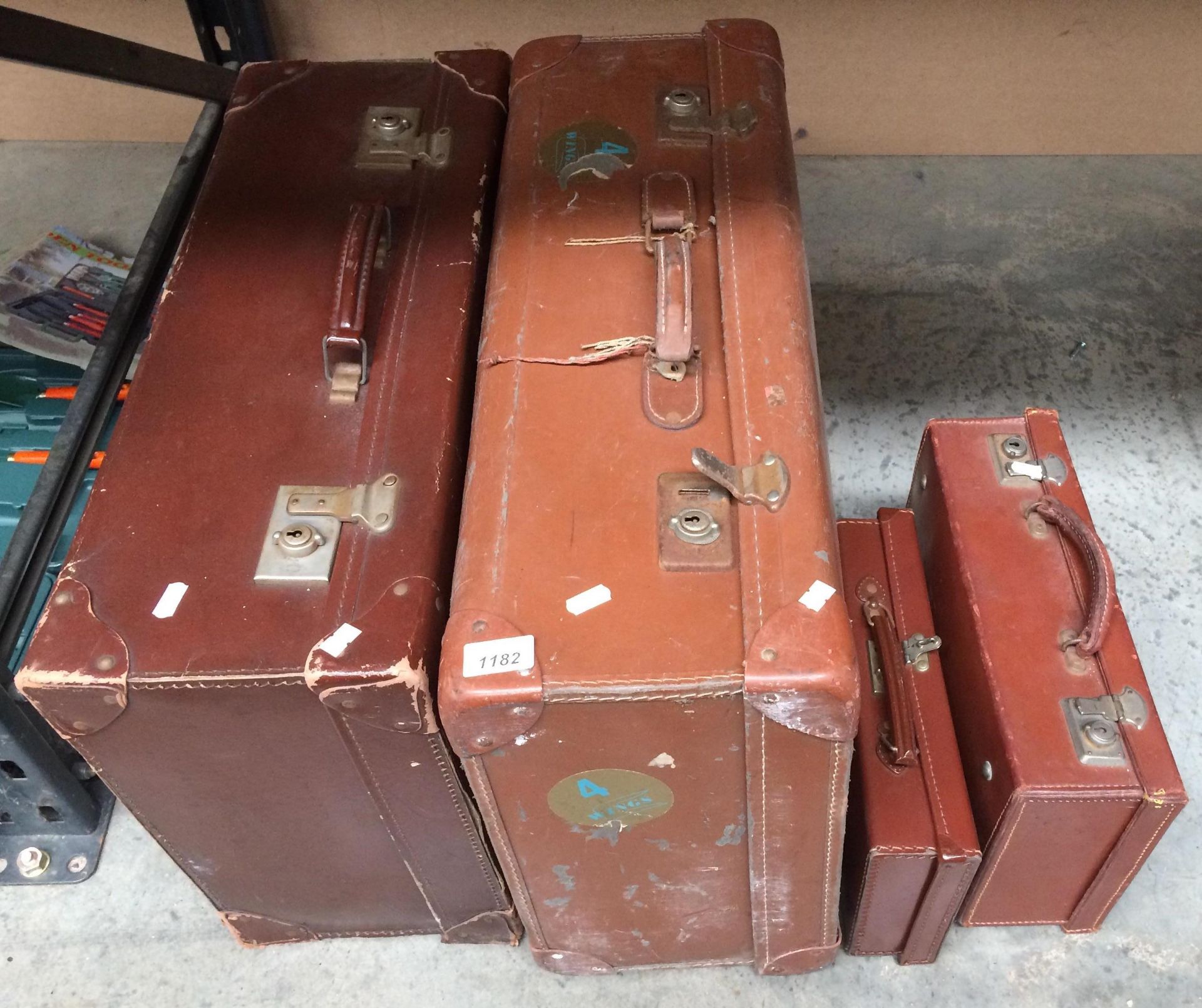 Four assorted brown leather cases