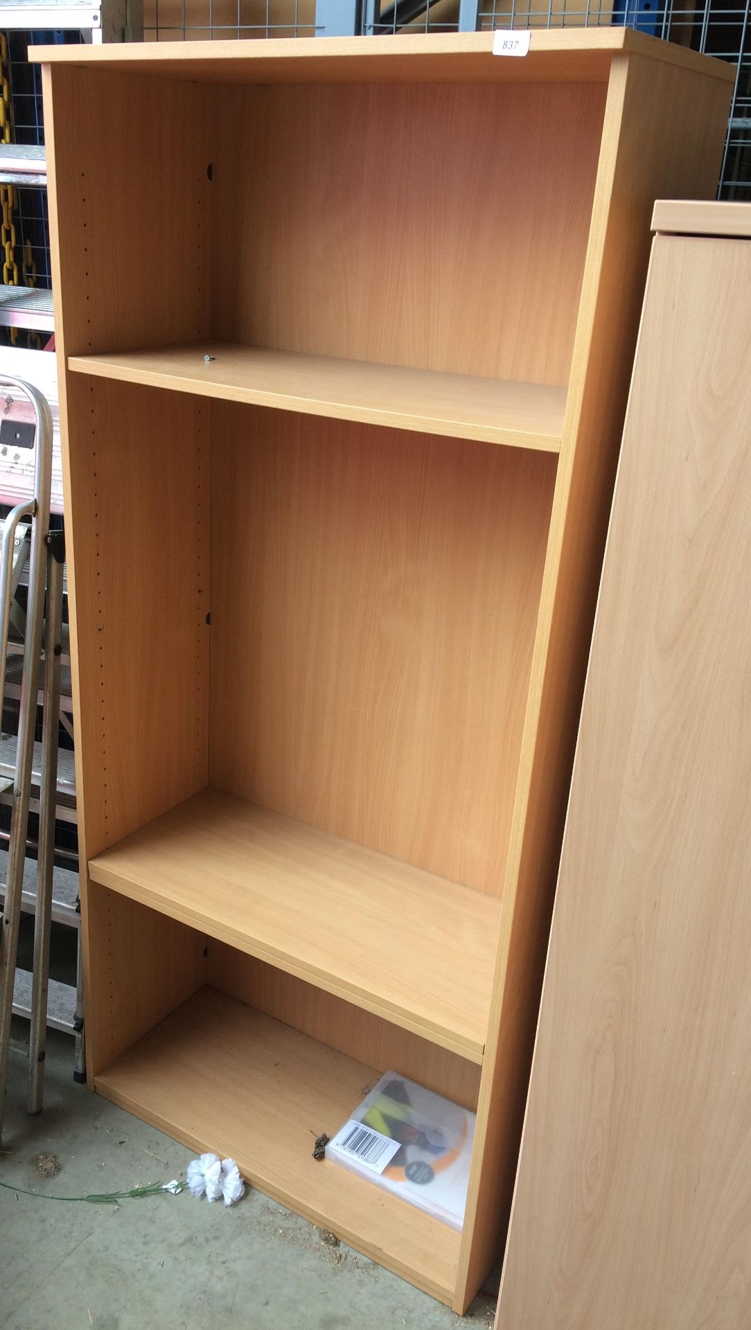 A light oak finish three shelf open bookcase