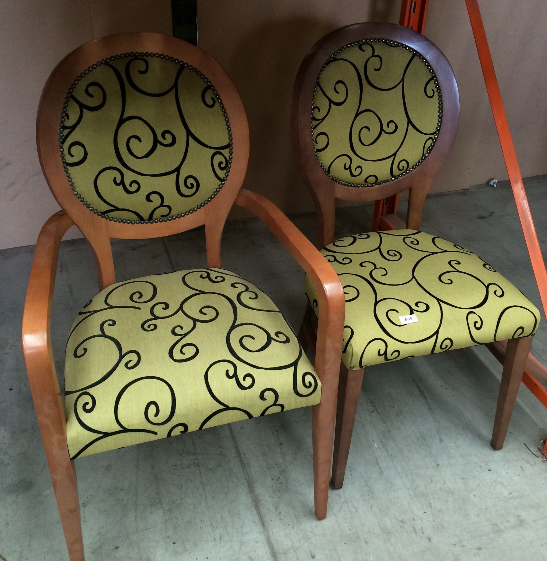 Two green dining chairs upholstered with black swirl pattern on oak frame (1 x carver)