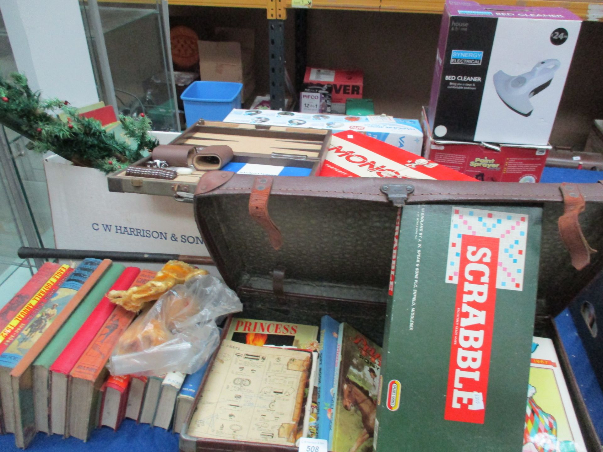 Contents to part of table - children's books and annuals, Gino Ferrari back gammon set, golf club,