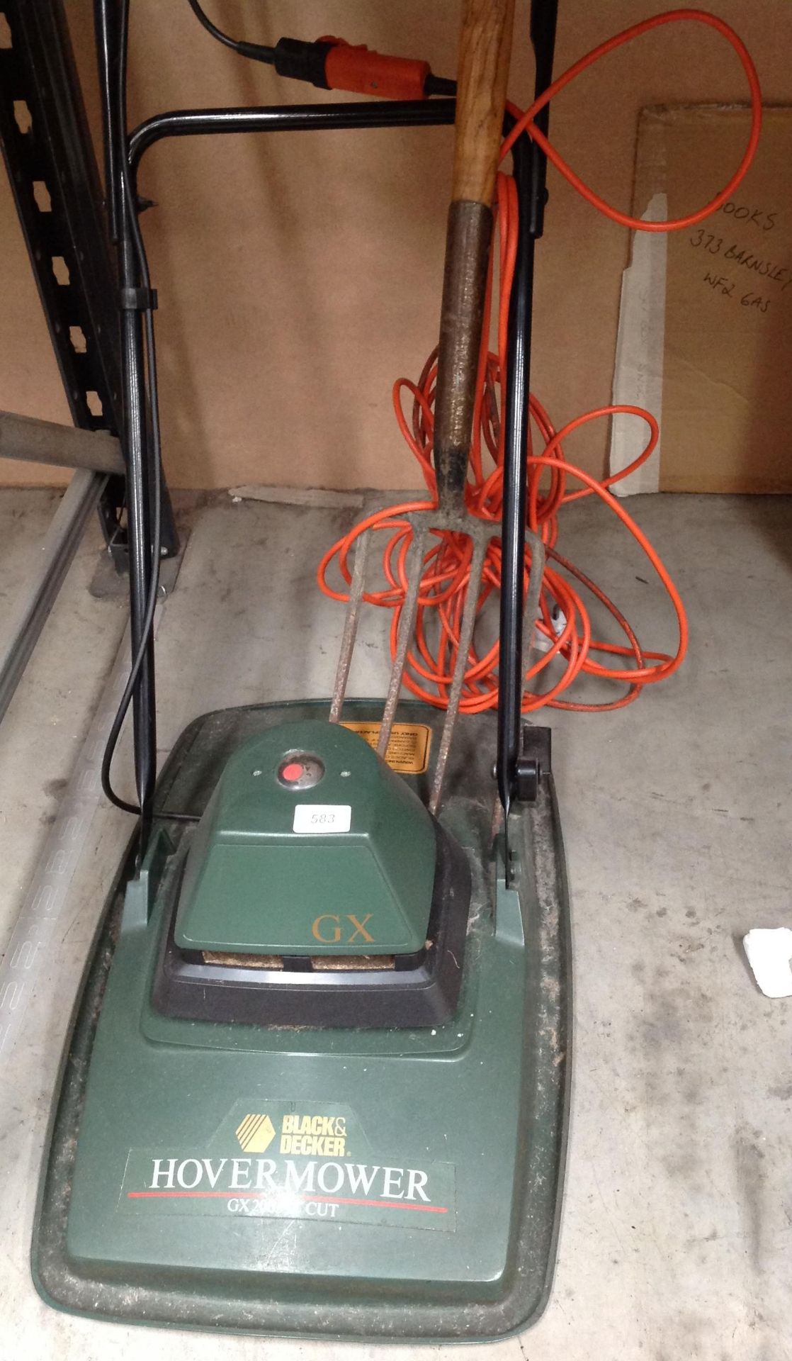 Black & Decker hover mower and a garden fork