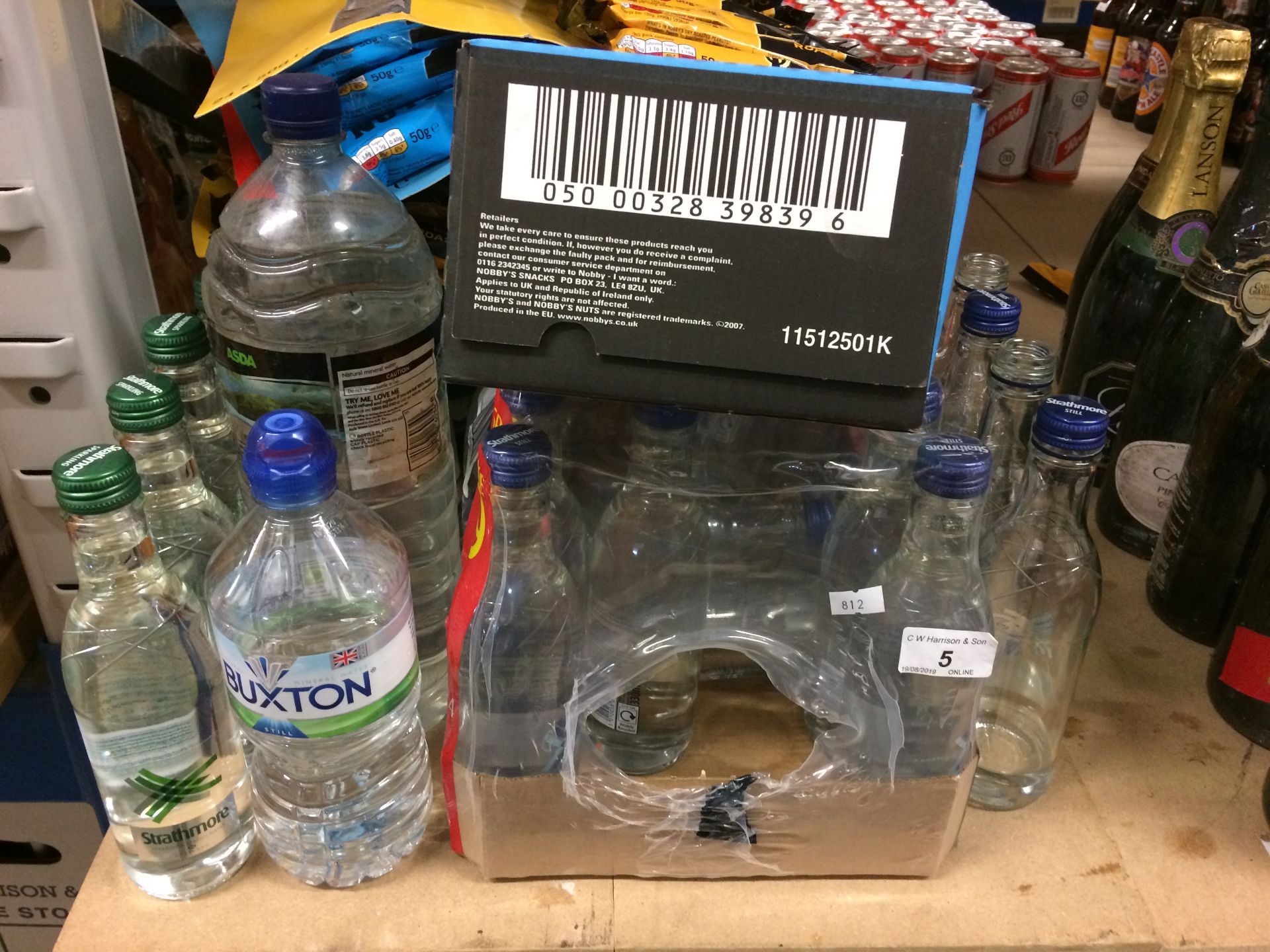 35 x assorted bottles of water by Strathmore and quantity of Nobby's nuts