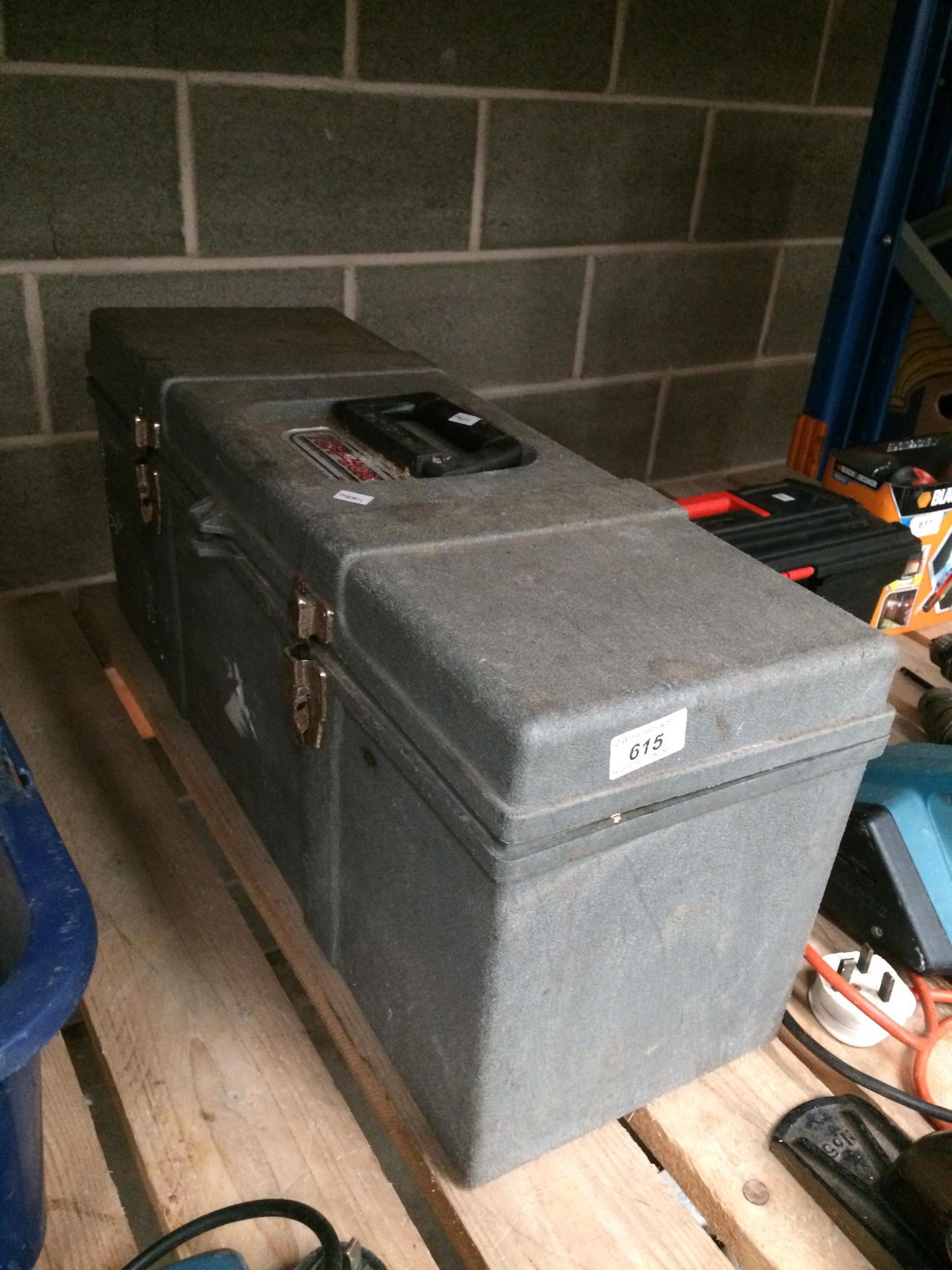 Large grey plastic tool box together with contents - hammer, spirit level etc.