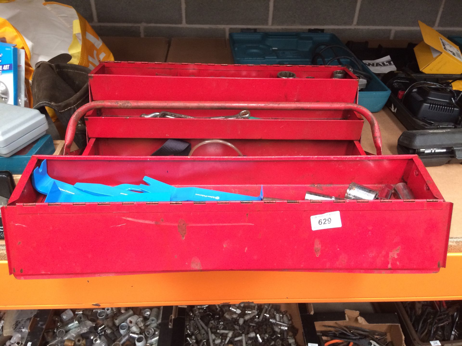 Red metal tool box and contents - spanners, sockets etc.