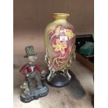 2 x items - cast metal "Ally Sloper" door stop and a Viking yellow and red glazed floral design