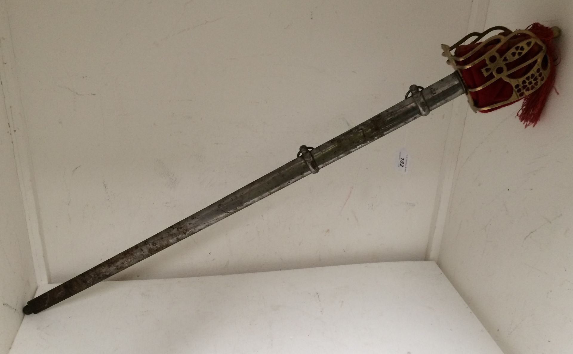 A cutlass sword with brass handle guard