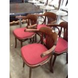A set of four Bentwood style dining armchairs with burgundy upholstered seats