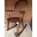 An oak 'Windsor style' child's armchair with rockers
