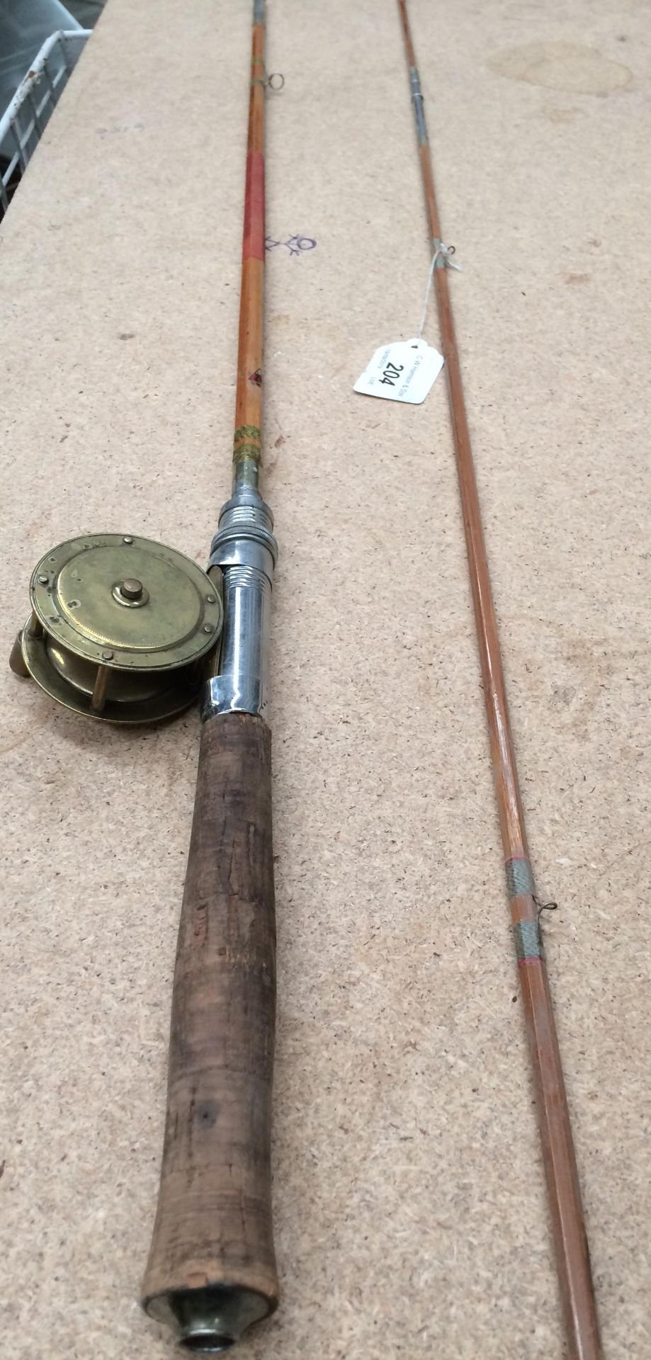 A Zenith Kobe split bamboo three piece fly rod together with a brass reel