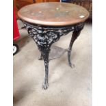 A cast metal Britannia style pub table with copper top by C. Whalley & Co.