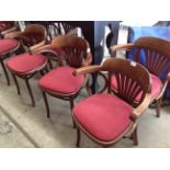 A set of seven Bentwood style dining armchairs with burgundy upholstered seats