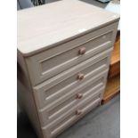 A limed oak finish four drawer chest of drawers
