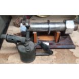 2 x items - propane burner and a large nut and bolt on wooden display plinth