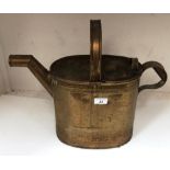 A brass watering can