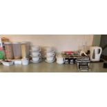 Contents to part of top of counter white ceramic cups, saucers, kettle,