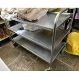 A stainless steel three tier tea trolley