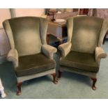 Pair of green dralon upholstered wing back armchairs