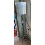 A grey painted metal standard lamp complete with shade
