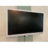 A Logik 23" wall mounting flat screen TV complete with remote control and wall bracket