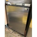 A stainless steel cased under counter fridge