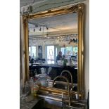 An ornate gilt framed wall mirror,