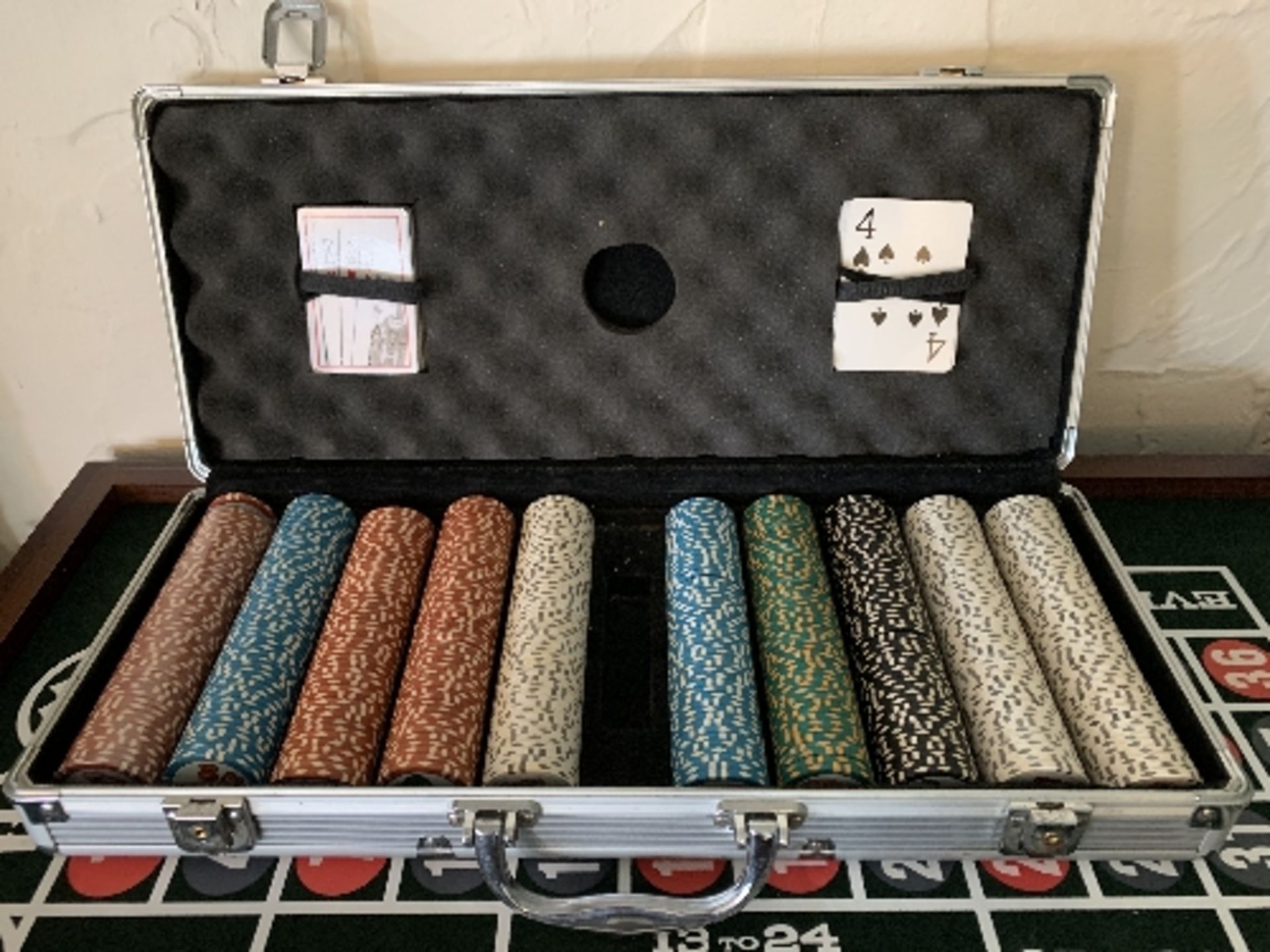 An aluminium case containing large quantity game chips