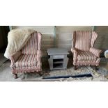 Pair of Regency style pink and cream patterned fabric wing back armchairs,