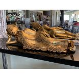Gilt composite model of a reclining Buddha 75cm long