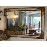 A wood and gilt bevel edge wall mirror 75 x 105cm