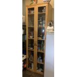 A lightwood finish two perspex door tall kitchen cabinet (no contents)