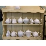 A quantity of white ceramic tea pots, jugs, cups, saucers, cafeterias, plates etc.