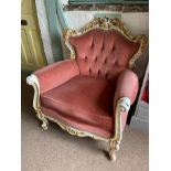An ivory and gilt ornate framed continental style armchair with pink dralon upholstery