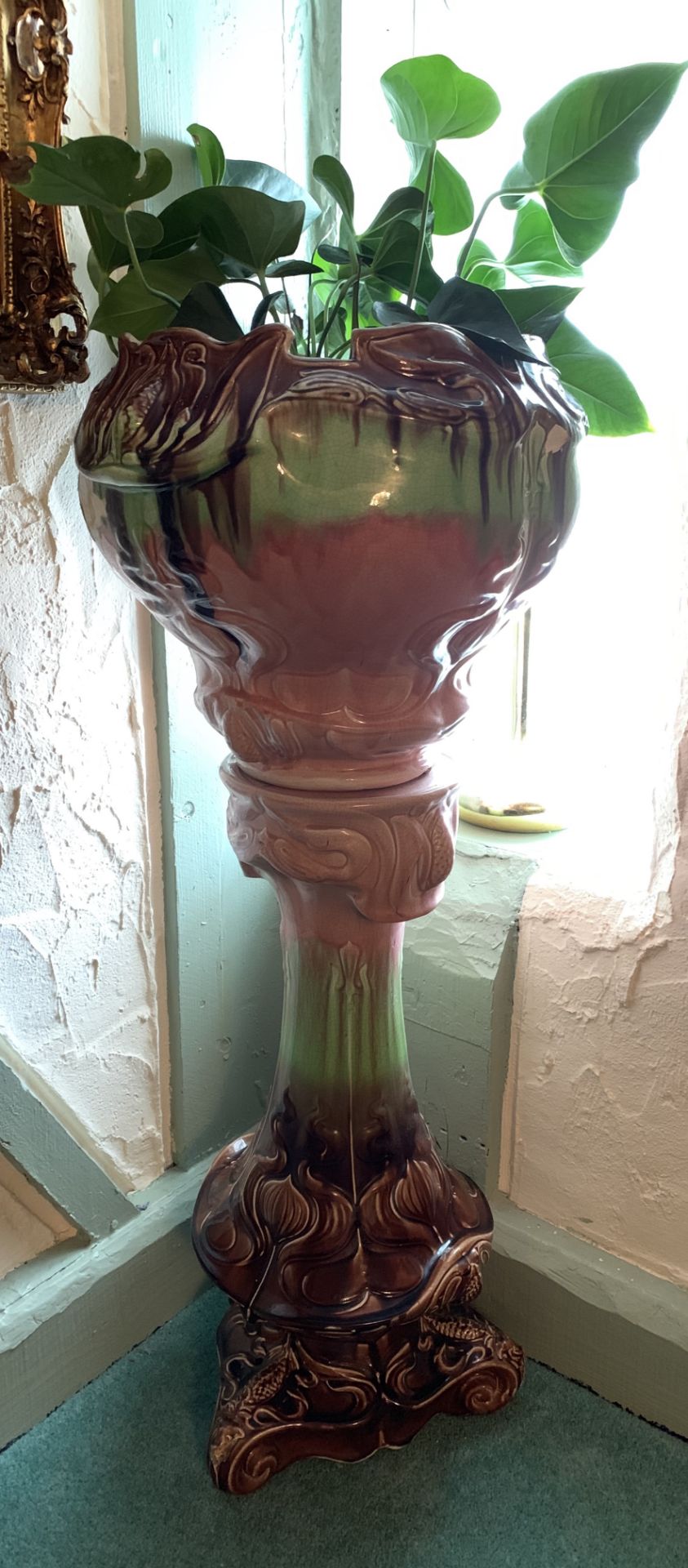 A brown and green glaze pottery jardiniere on pedestal 110cm high