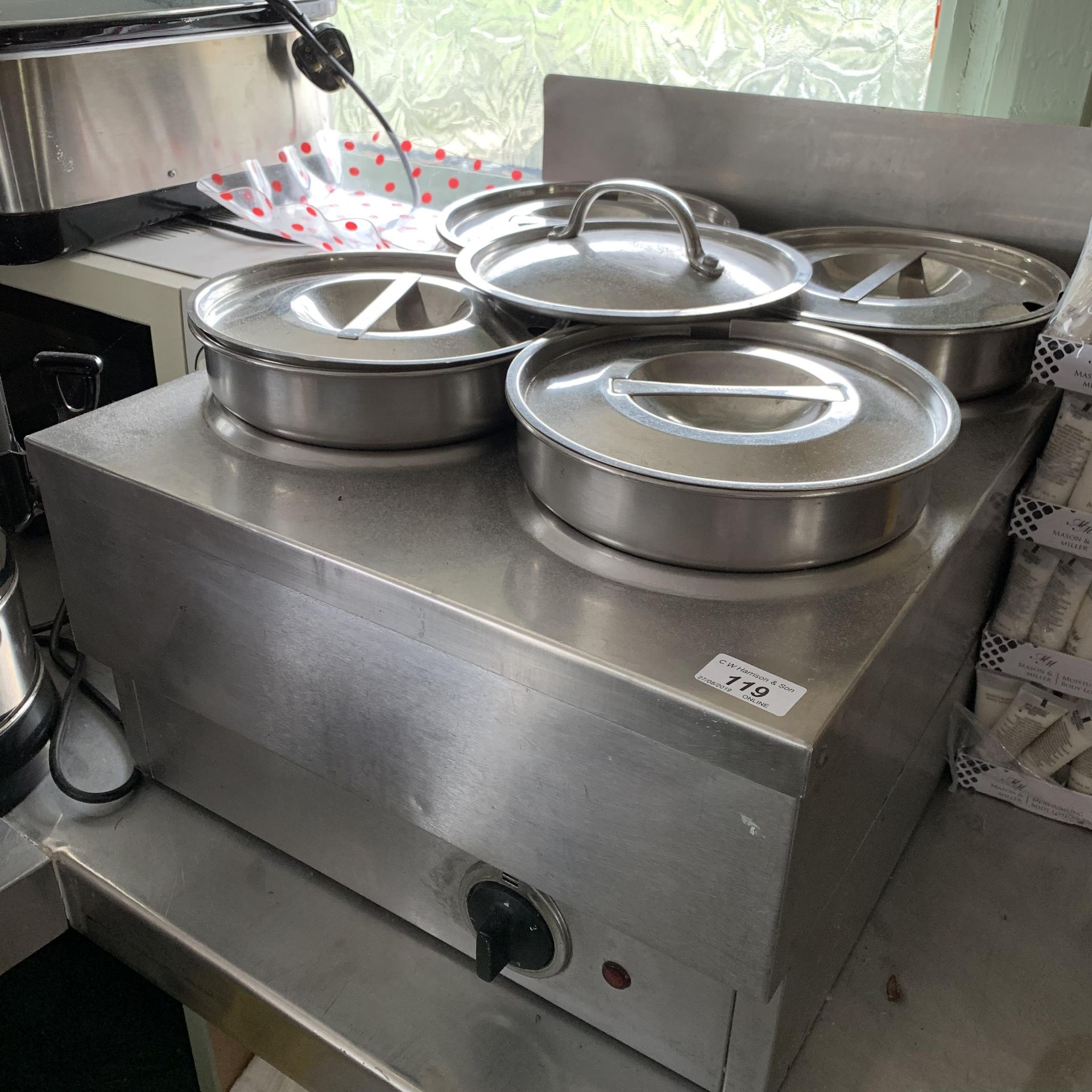 A stainless steel table top 4 pan bain marie