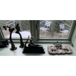 A silver coloured reproduction desk set and three reproduction Art Deco style figurines one on a