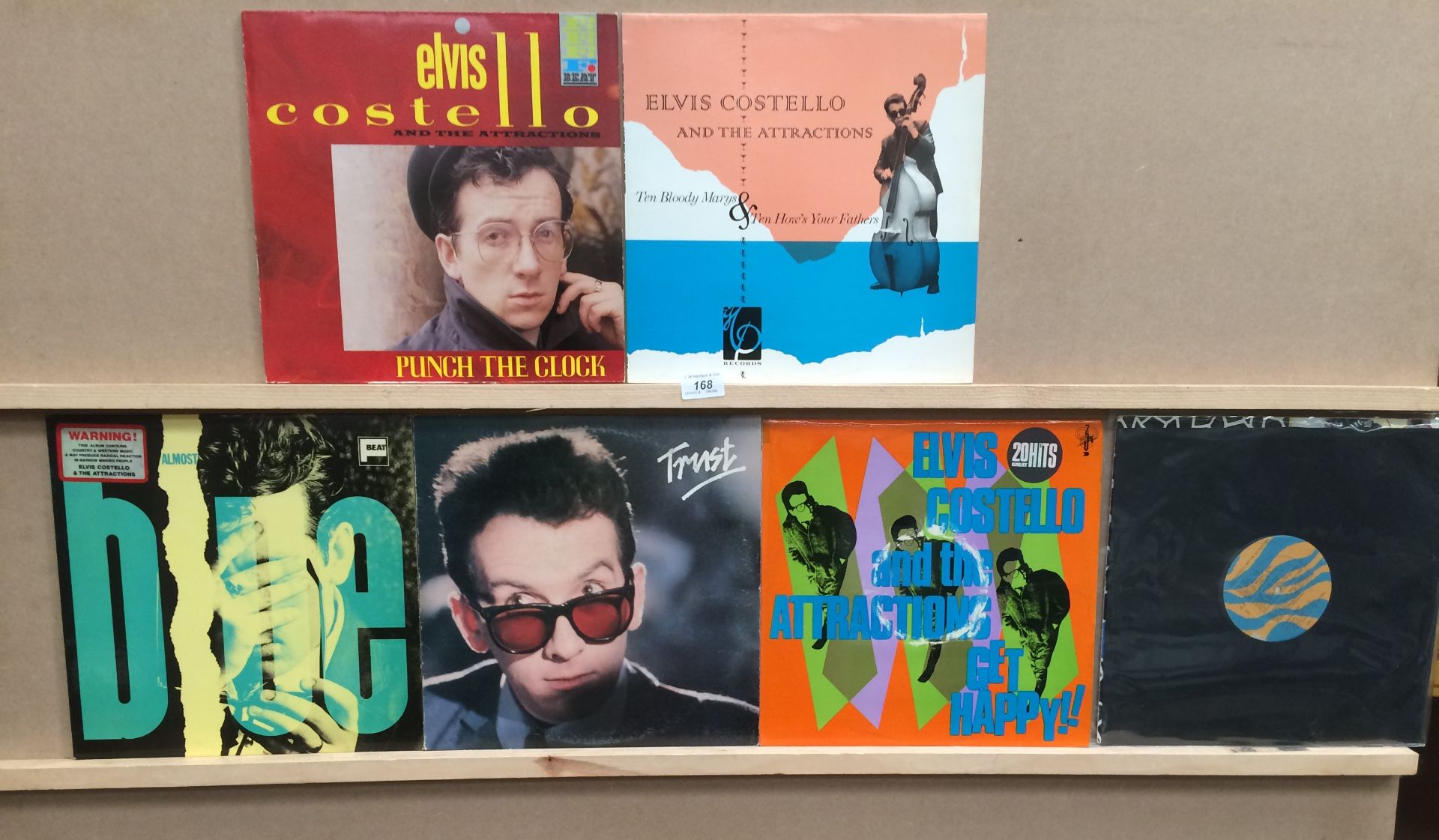 Five 12" vinyl records by Elvis Costello