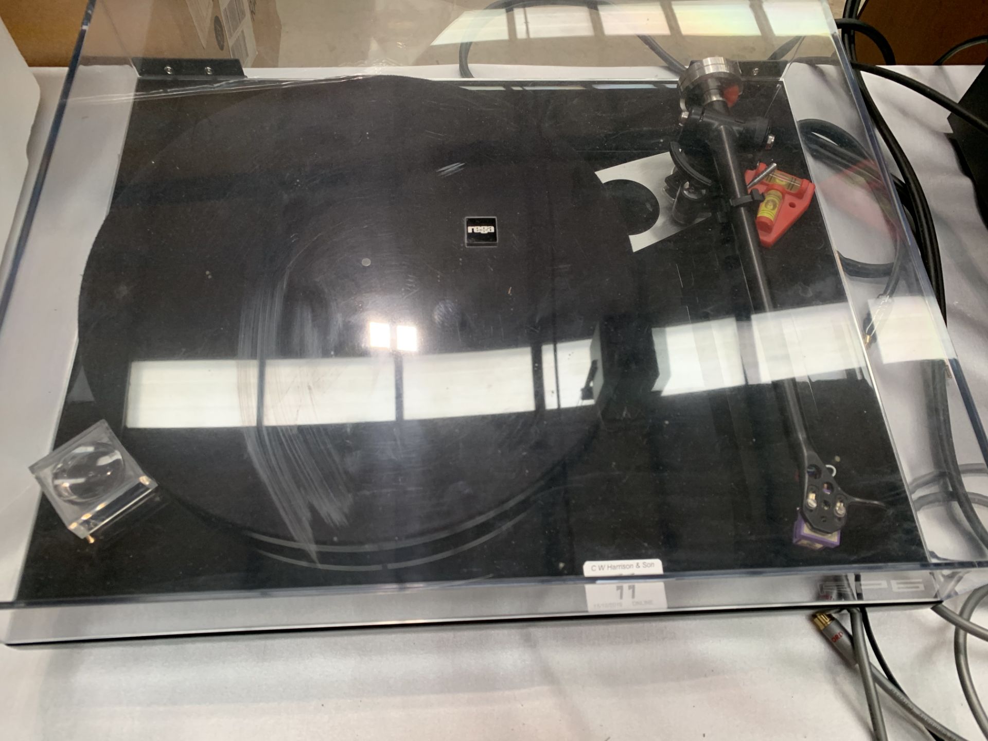 A Rega RP6 turntable in gloss black together with a Rega 101949 fono stage unit,