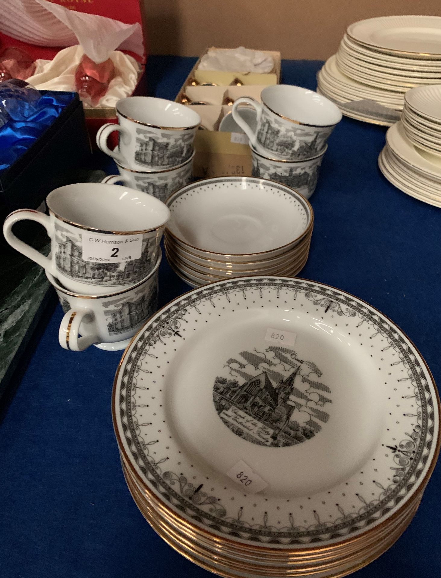 An eighteen piece tea service transfer printed with scenes of Ossett and a twelve piece gilt and