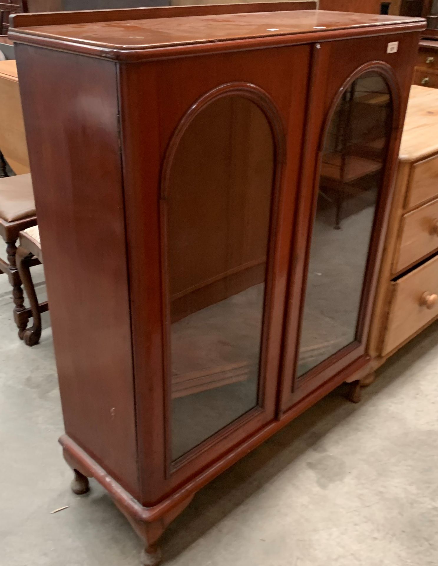 A mahogany two glazed door bookcase 90 x 115cm high