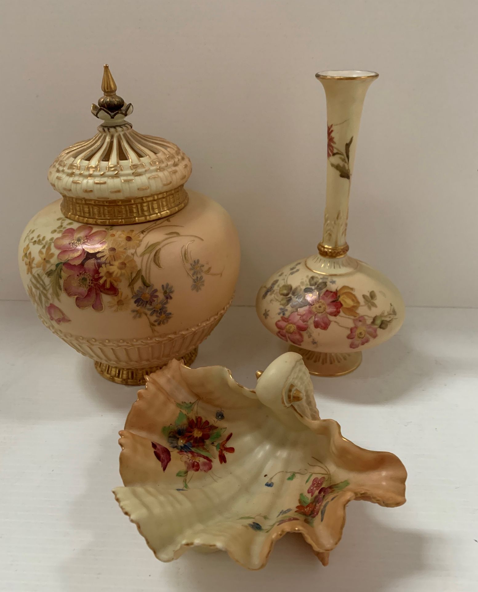 Three items, Royal Worcester china blush ivory, comprising pot pourri jar and cover (lacking liner,