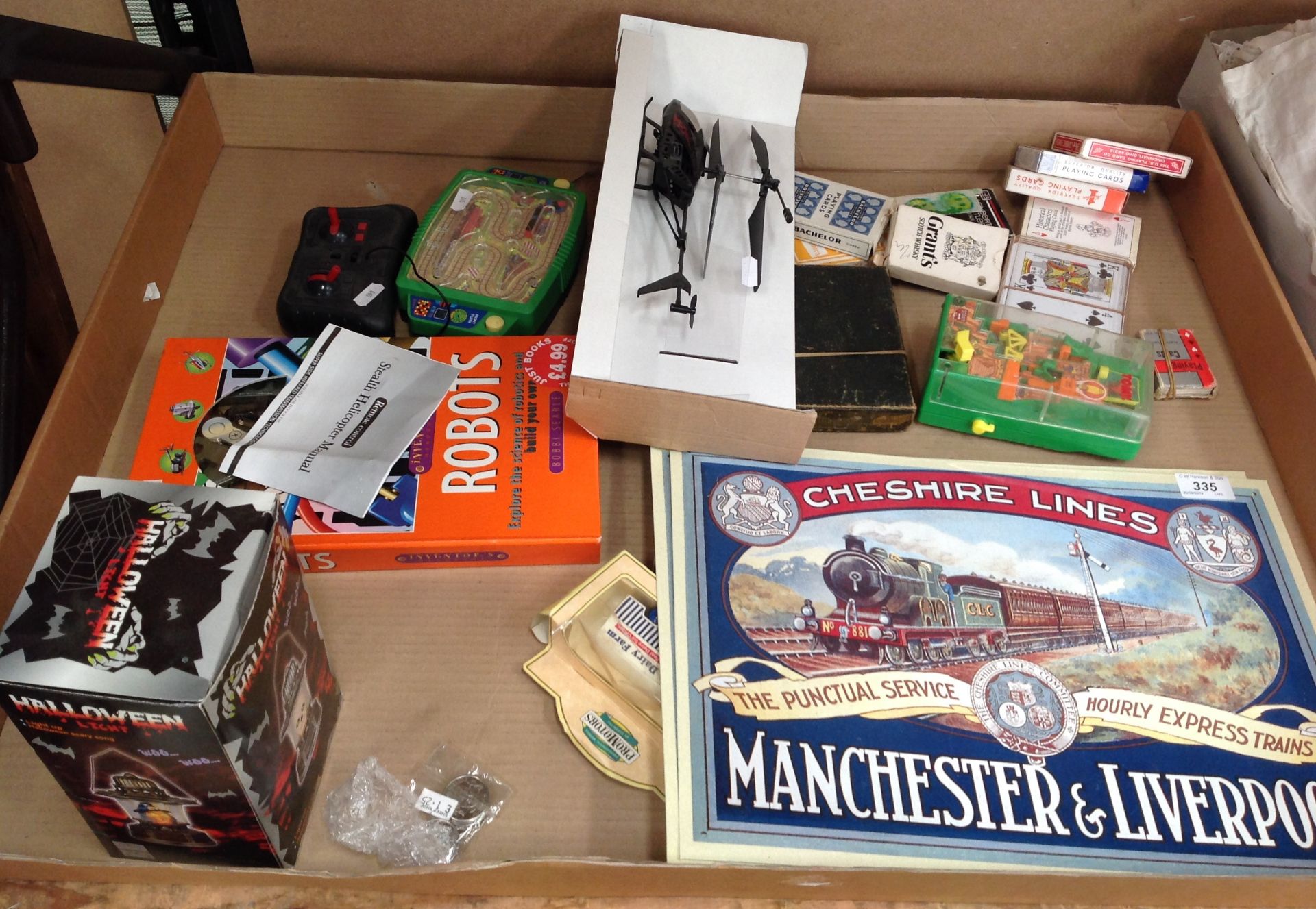 Contents to tray - card games, tin plate sign, remote control helicopter etc.