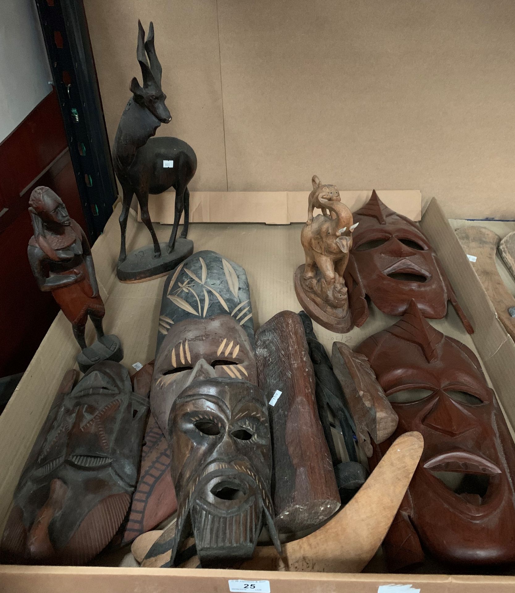 Contents to tray - wood wall masks, carved wood animals etc.