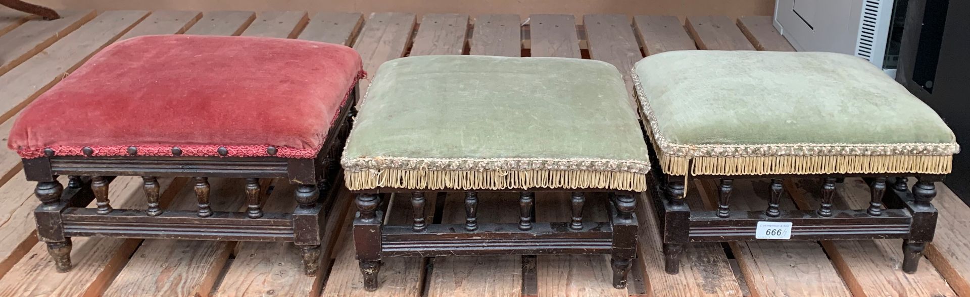 Three wood framed footstools with upholstered tops