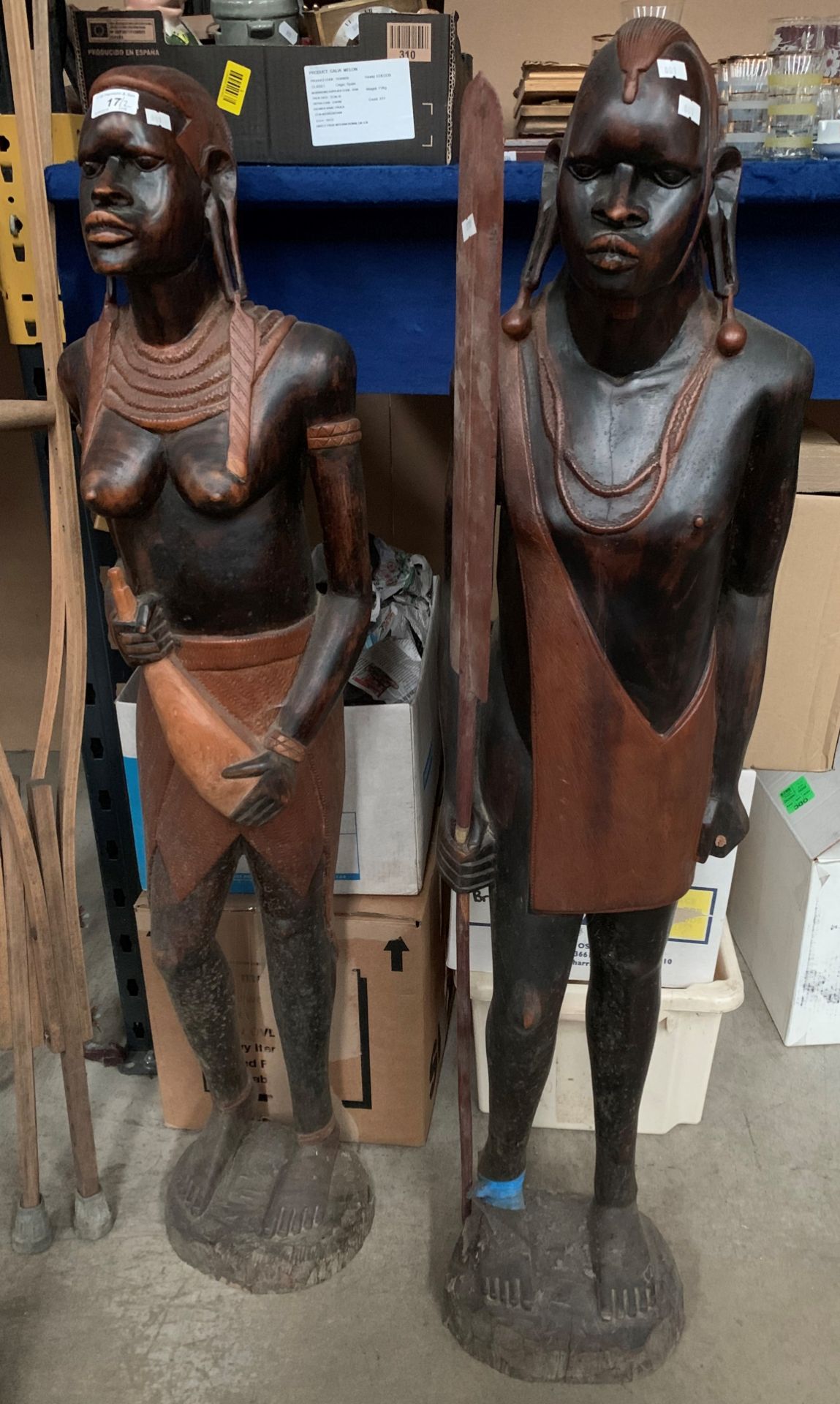 Two large carved wood African male and female figures each approx 125cm high