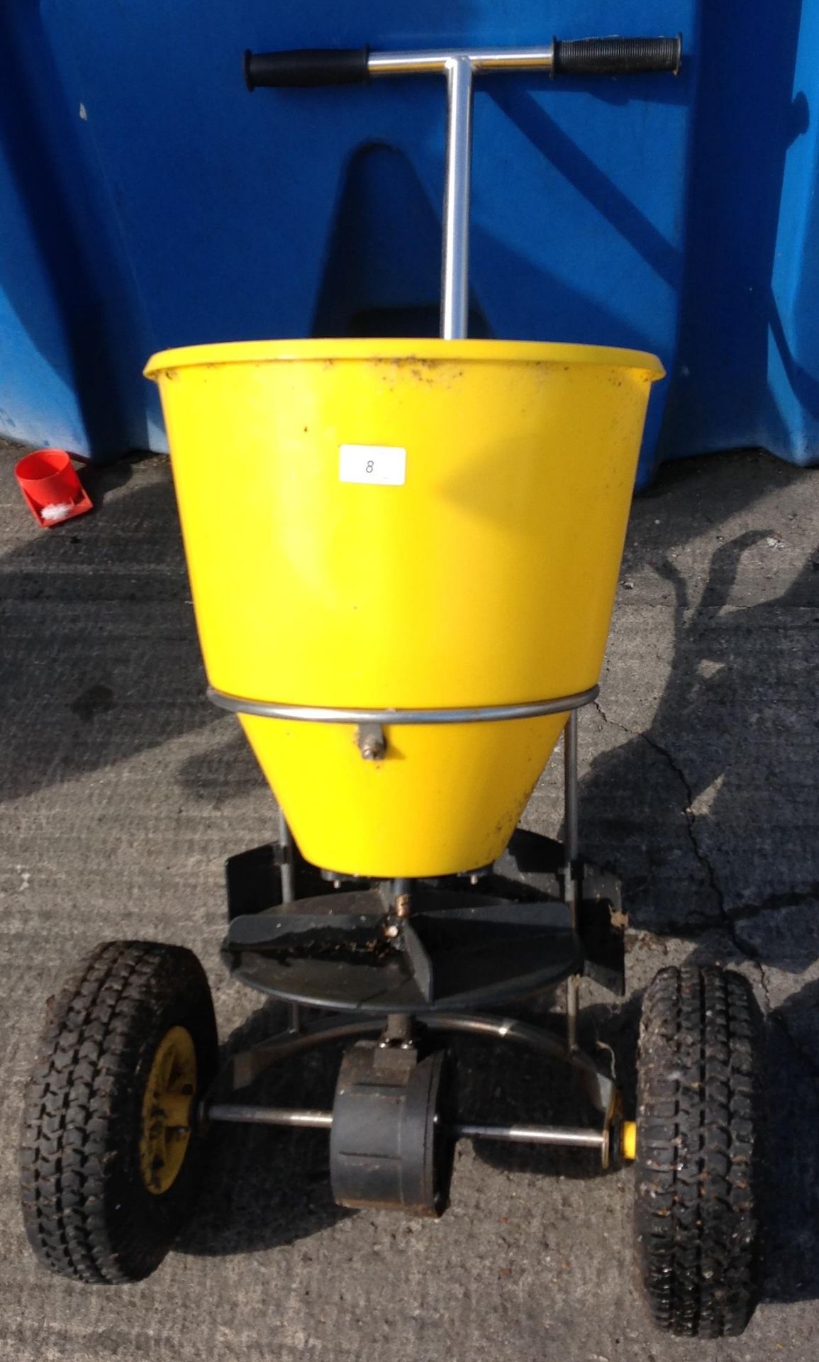 Hand operated two wheel salt spreader