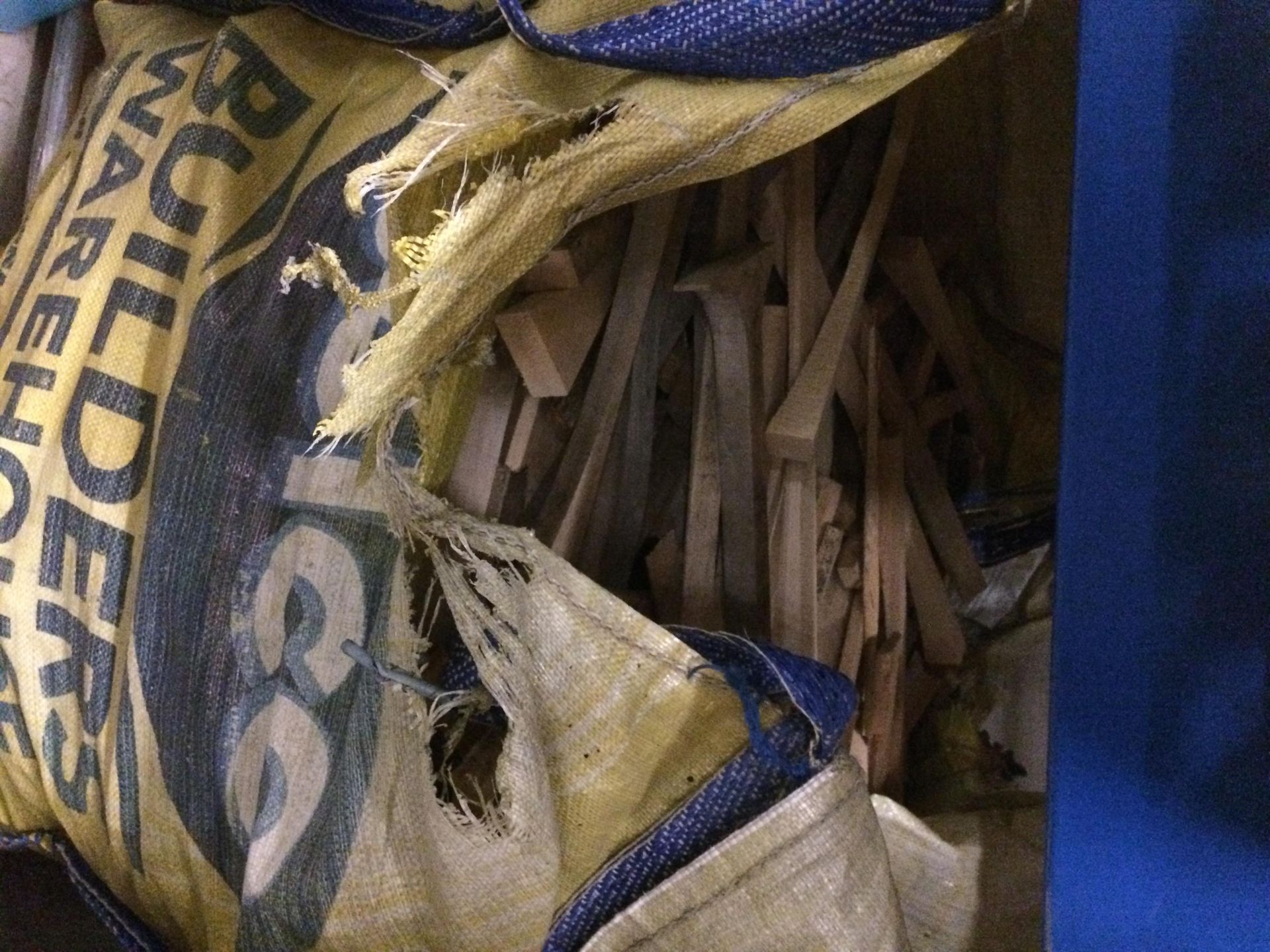 Contents to builders sack - off cut kindling