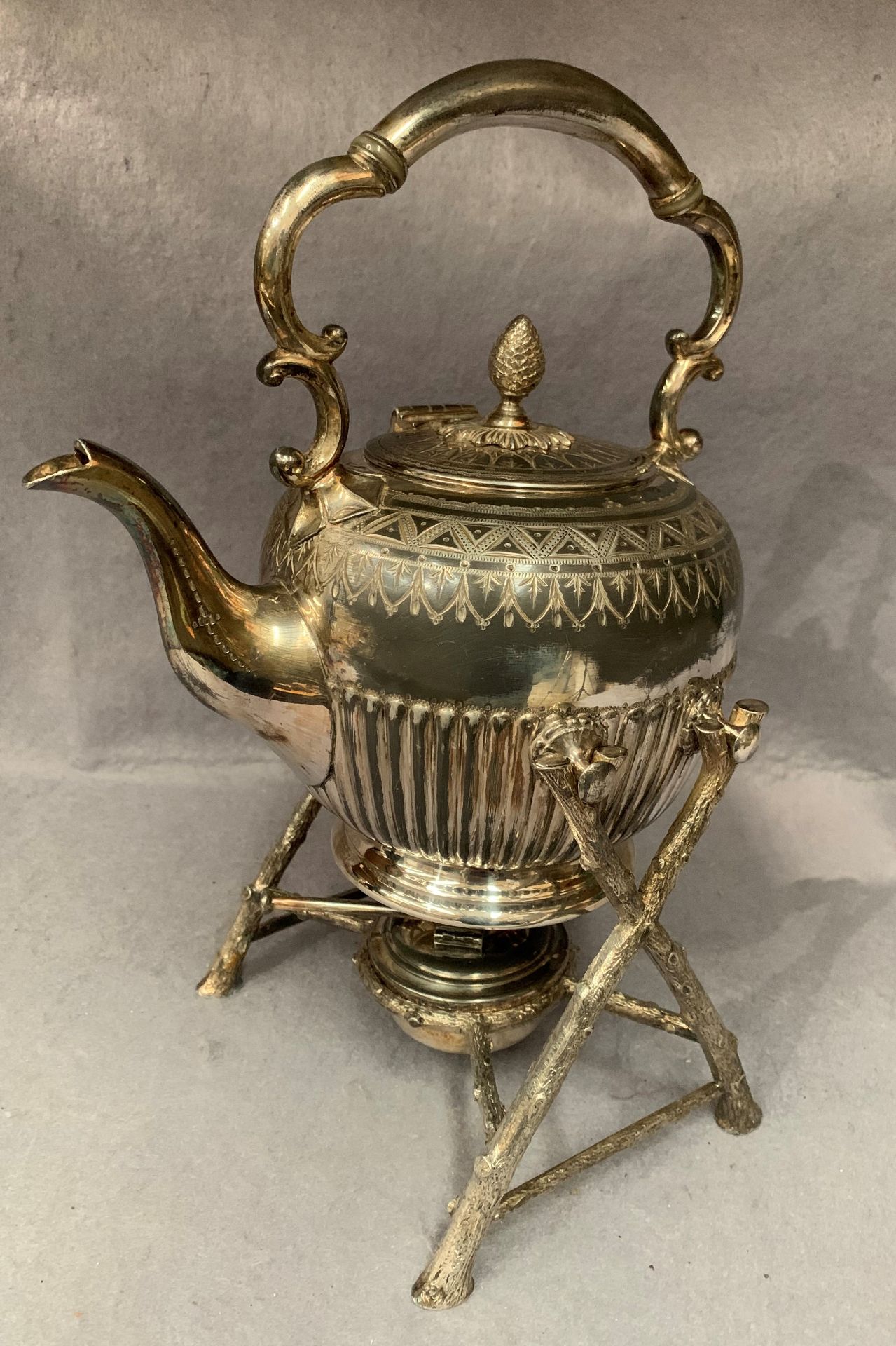 A silver plated spirit kettle on later stand